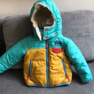 Patagonia reversible toddler coat. Only worn a few times because he’s so big